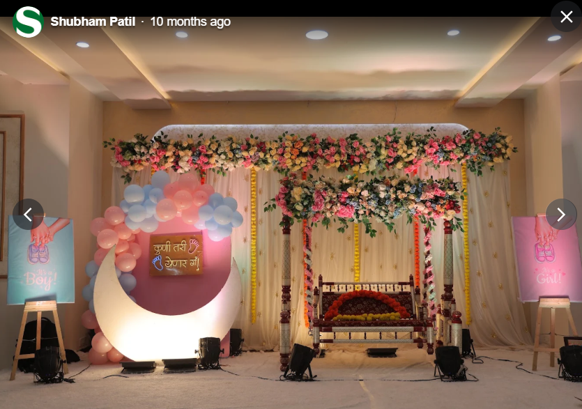 Boy or girl baby shower reveal stage with floral swing