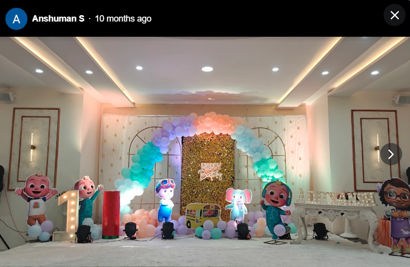 Cocomelon themed first birthday stage with cut-outs