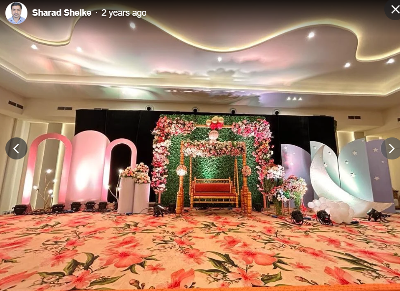 Floral cradle swing framed by a rose and jasmine arch