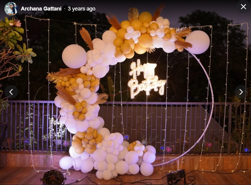 Gold and white balloon ring arch with fairy lights