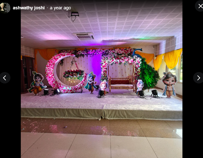 Krishna themed floral arch and swing stage